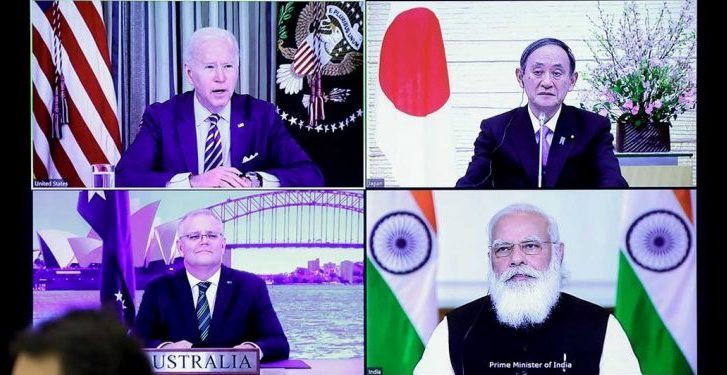 A monitor displaying a virtual meeting with U.S. President Joe Biden (top L), Australia's Prime Minister Scott Morrison (bottom L), Japan's Prime Minister Yoshihide Suga (top R) and India's Prime Minister Narendra Modi is seen during the virtual Quadrilateral Security Dialogue (Quad) meeting, at Suga's official residence in Tokyo March 12, 2021. (PC: onmanorama.com)