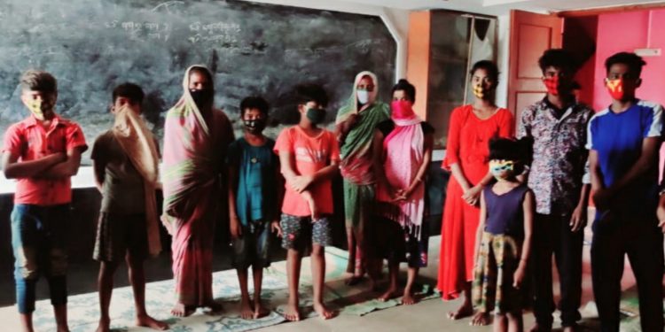 People at a cyclone shelter in Bhadrak district