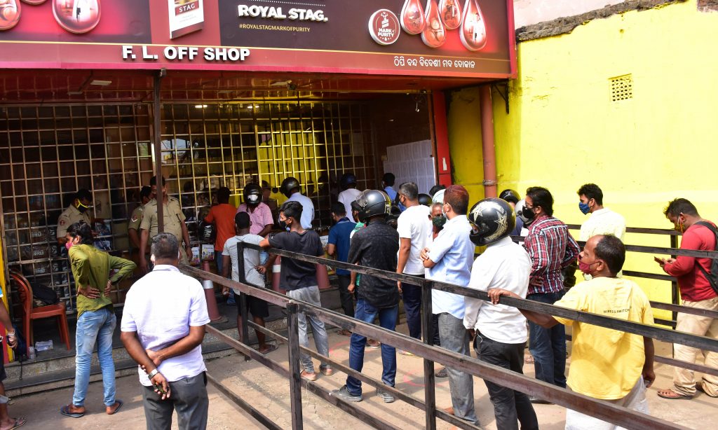 Denizens crowd liquor shops