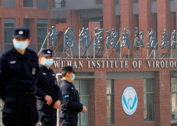 Security personnel keep watch outside the Wuhan Institute of Virology during the visit by the World Health Organization team tasked with investigating the origins of Covid-19, in Wuhan 	(REUTERS FILE PHOTO)