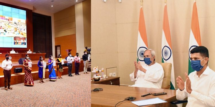 Chief Minister Naveen Patnaik and 5T Secretary VK Pandian during the induction programme, Thursday