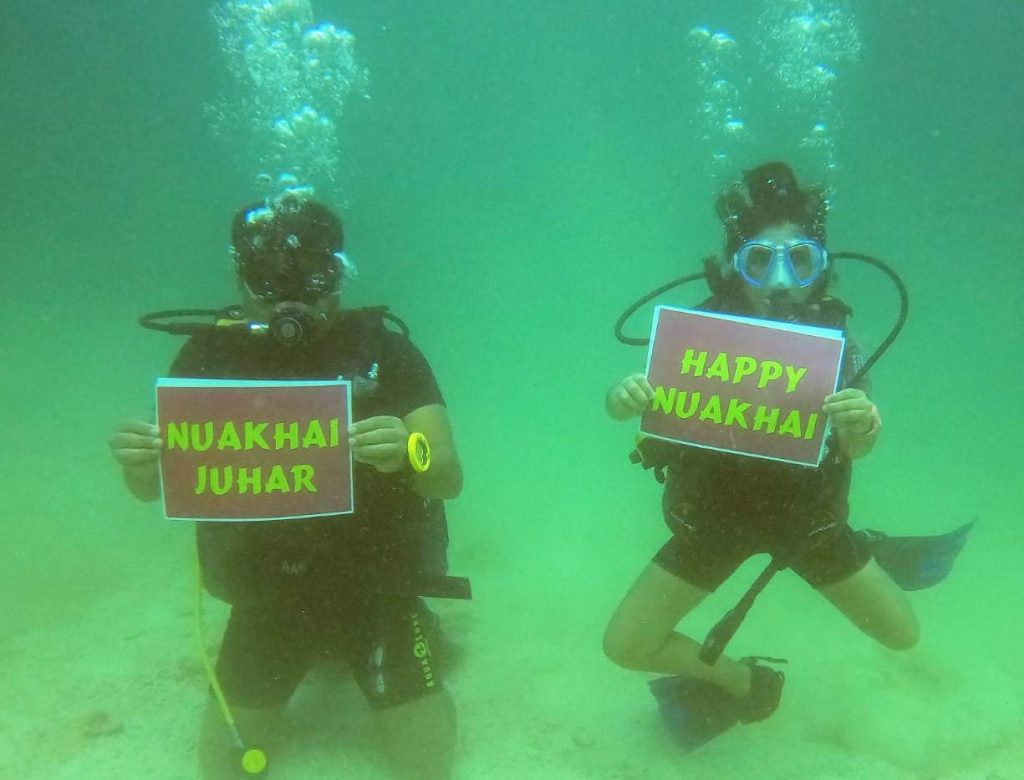 Young scuba diver, father send out Nuakhai wishes from 40-feet below sea 