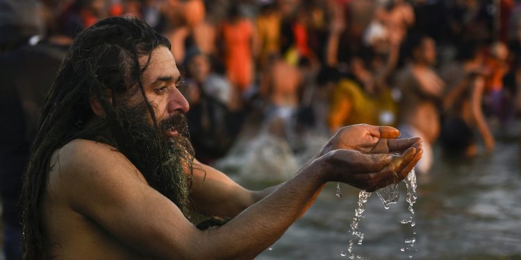 Allahabad: A Sadhu takes a holy dip at Sangam on the auspicious Makar Sankranti day during the Kumbh Mela, or pitcher festival, in Allahabad (Prayagraj), Tuesday, Jan. 15, 2019. (PTI Photo/Ravi Choudhary)(PTI1_15_2019_000078B)