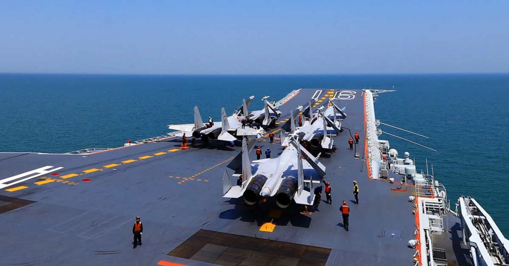 This file photo shows J15 fighter jets on China's sole operational aircraft carrier, the Liaoning, during a drill at sea. (AFP photo via theaseanpost.com)