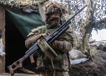 A Ukrainian soldier stands at the line of separation from pro-Russian rebels in Donetsk region, Ukraine [AP Photo via aljazeera.com]