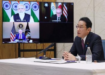 Japanese Prime Minister Fumio Kishida attends the Quad online meeting at Prime Minister’s Office in Tokyo with (on screen) Prime Minister Narendra Modi, U.S. president Joe Biden and Australia’s Prime Minister Scott Morrison March 3, 2022. (File Photo: Japan Cabinet Public Relations Office via AFP)