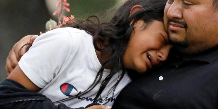 People console each other after another mass shooting at a school in the US [PC: Reuters]