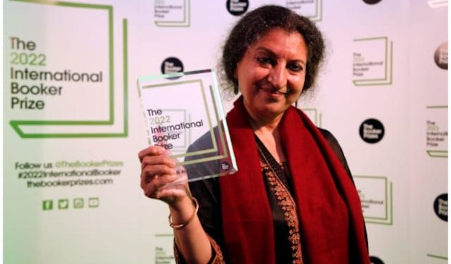 Author Geetanjali Shree poses with the 2022 International Booker Prize award for her novel 'Tomb of Sand' in London. (AP/PTI)