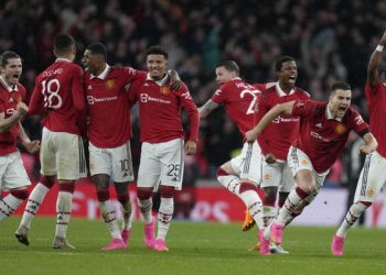 Manchester United players celebrate after winning the English FA Cup semifinal soccer match between Brighton and Hove Albion and Manchester United at Wembley Stadium in London, Sunday, April 23, 2023. (AP Photo/Kirsty Wigglesworth)