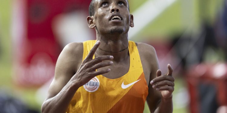 Berihu Aregawi of Ethiopia celebrates after winning the 5000m Men during the World Athletics Diamond League Athletissima athletics meeting at the Stade Olympique de la Pontaise in Lausanne, Switzerland, Friday, June 30, 2023. (Valentin Flauraud/Keystone via AP)