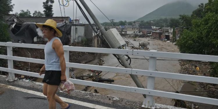 Chinese state media says flooding around Beijing kills 11; 27 people missing