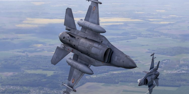 Portuguese Air Force F- 16 military fighter jets participating in NATO's Baltic Air Policing Mission operates in Lithuanian airspace, Monday, May 22, 2023. (AP Photo/Mindaugas Kulbis)