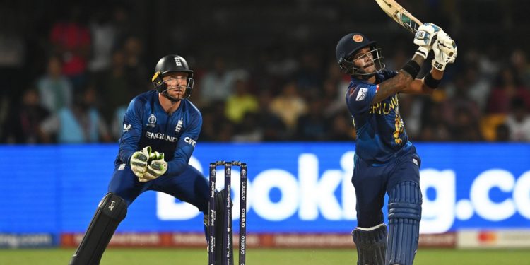 BANGALORE, INDIA - OCTOBER 26: Pathum Nissanka of Sri Lanka plays a shot as Jos Buttler of England keeps during the ICC Men's Cricket World Cup India 2023 between England and Sri Lanka at M. Chinnaswamy Stadium on October 26, 2023 in Bangalore, India. (Photo by Gareth Copley/Getty Images)