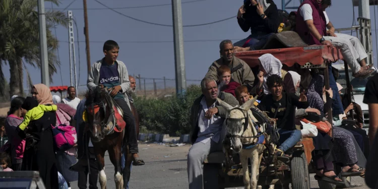 Patients and staff leave Gaza's biggest hospital, and dozens are killed at a crowded refugee camp