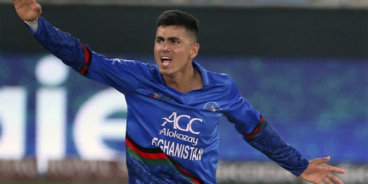 Afghanistan's Mujeeb Ur Rahman appeals unsuccessfully for the wicket of India's Deepak Chahar during the one day international cricket match of Asia Cup between India and Afghanistan in Dubai, United Arab Emirates, Tuesday, Sept. 25, 2018. On the right is India's Ravindra Jadeja. (AP Photo/Aijaz Rahi)