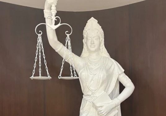 Supreme Court's Lady Justice now holds constitution, not sword; loses blindfold