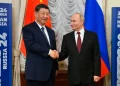 Russian President Vladimir Putin, right, and Chinese President Xi Jinping shake hands during their meeting on the sidelines of BRICS Summit at Kazan Kremlin in Kazan, Russia, Tuesday, Oct. 22, 2024. (AP)