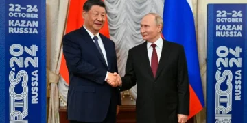 Russian President Vladimir Putin, right, and Chinese President Xi Jinping shake hands during their meeting on the sidelines of BRICS Summit at Kazan Kremlin in Kazan, Russia, Tuesday, Oct. 22, 2024. (AP)