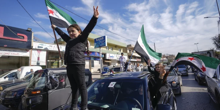 Syrians celebrate in streets as rebels reach Damascus; Russia grants asylum to Assad & family