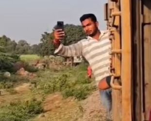 Viral video: Boy taking selfie on moving train; outcome will amaze you